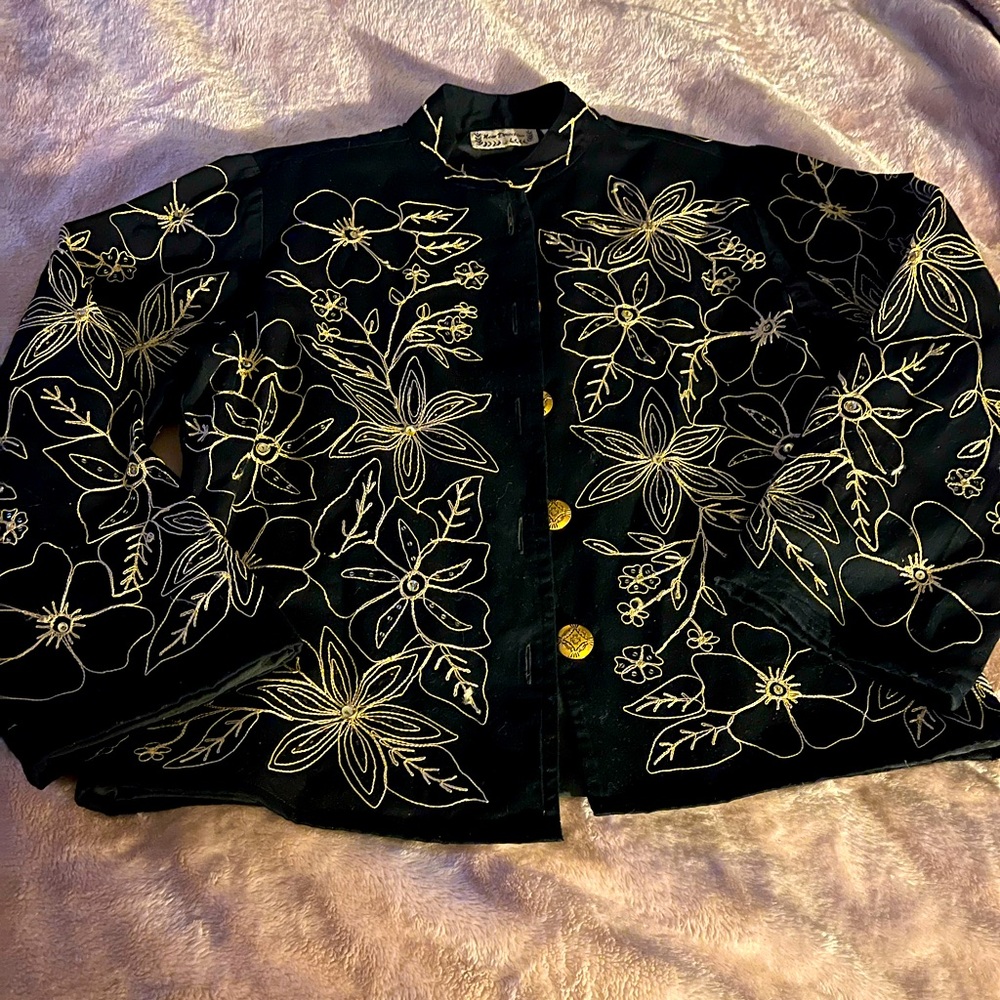 Woman’s button up jacket with embroidered flower design